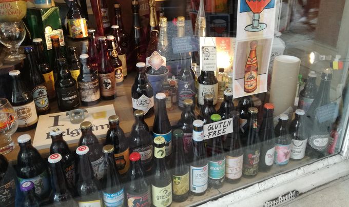 different types of beer in a shop window